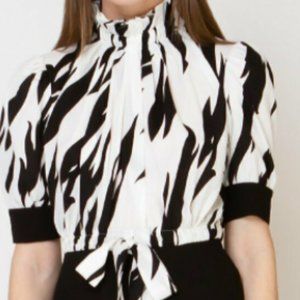 Gracia White with black peplum tie neck blouse